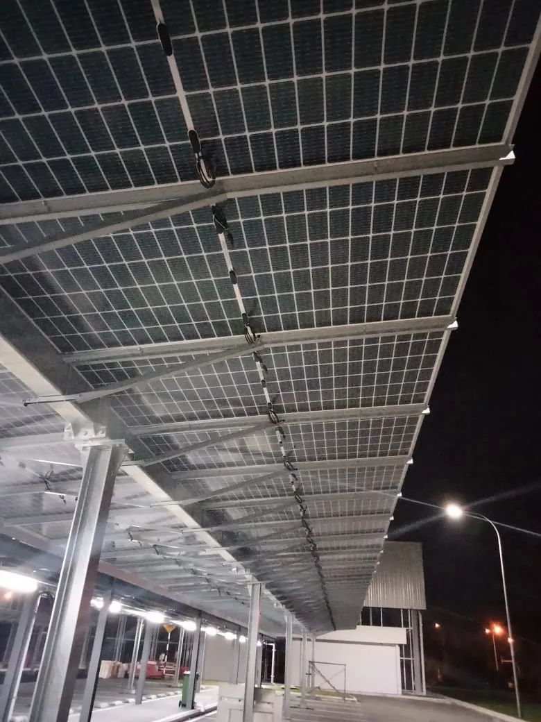 Solar carport and rooftop arrays at a food-ingredient plant (view 1)