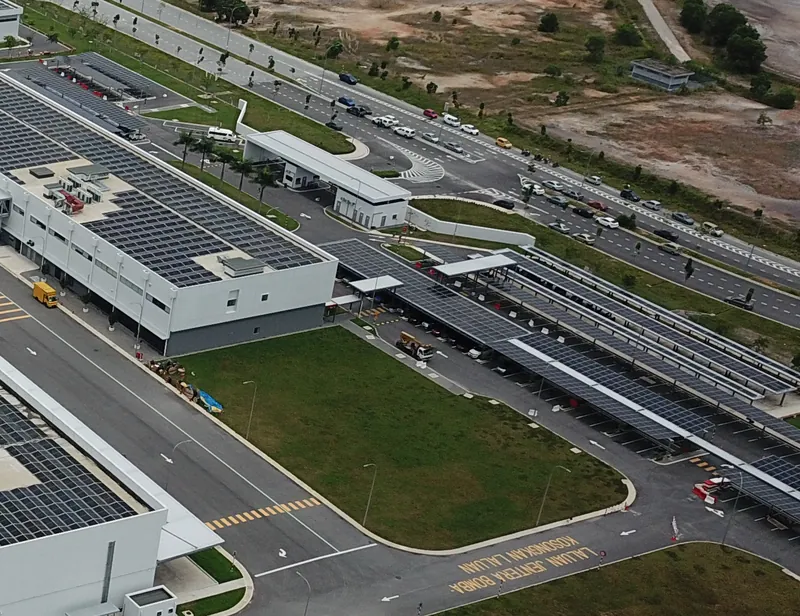 Solar carport and rooftop arrays at a food-ingredient plant