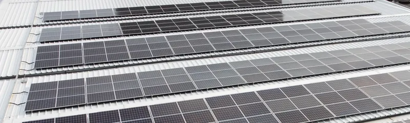 Solar panels on a fuel-station canopy roof, seen from above (view 1)